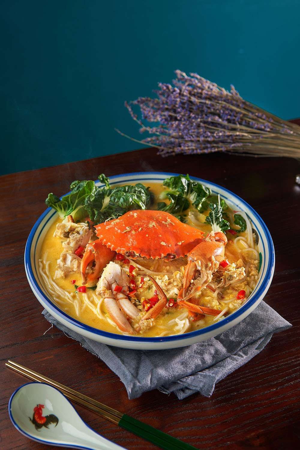Cheese Crab Bee Hoon: a whole crab and bee hoon in a golden cheese sauce with greens and sliced red chilli